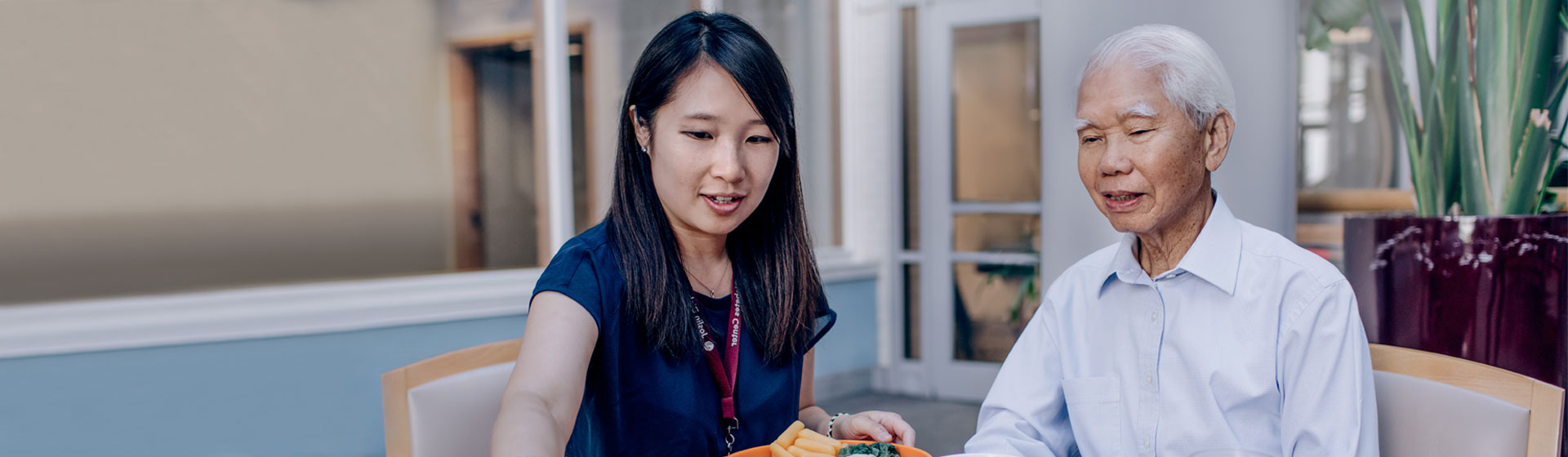 Asian nurse helping an Asian patient