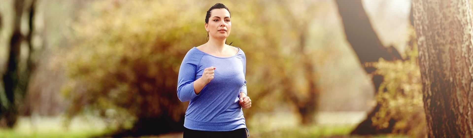 woman running outside in the fall