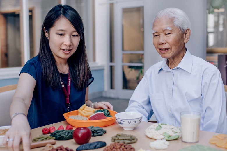 Asian nurse helping an Asian patient