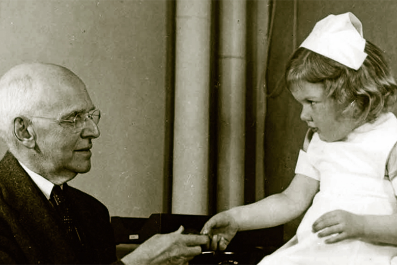 Old picture of a child patient and doctor at Joslin