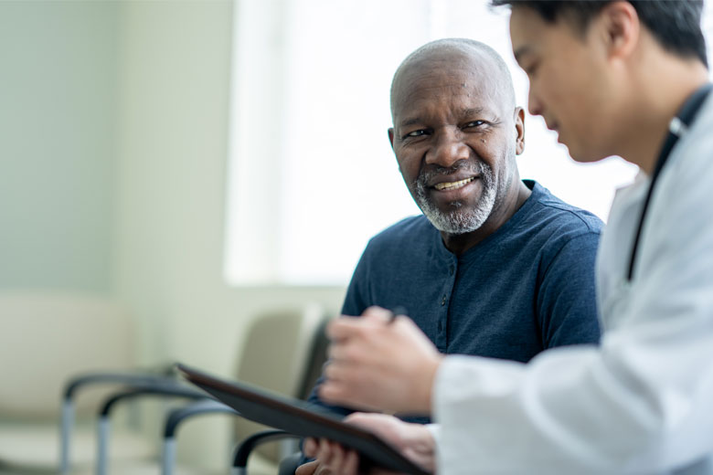 Doctor talking to an elderly man