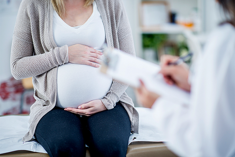 A pregnant woman at the doctors