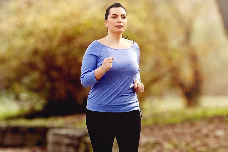 woman running outside in the fall